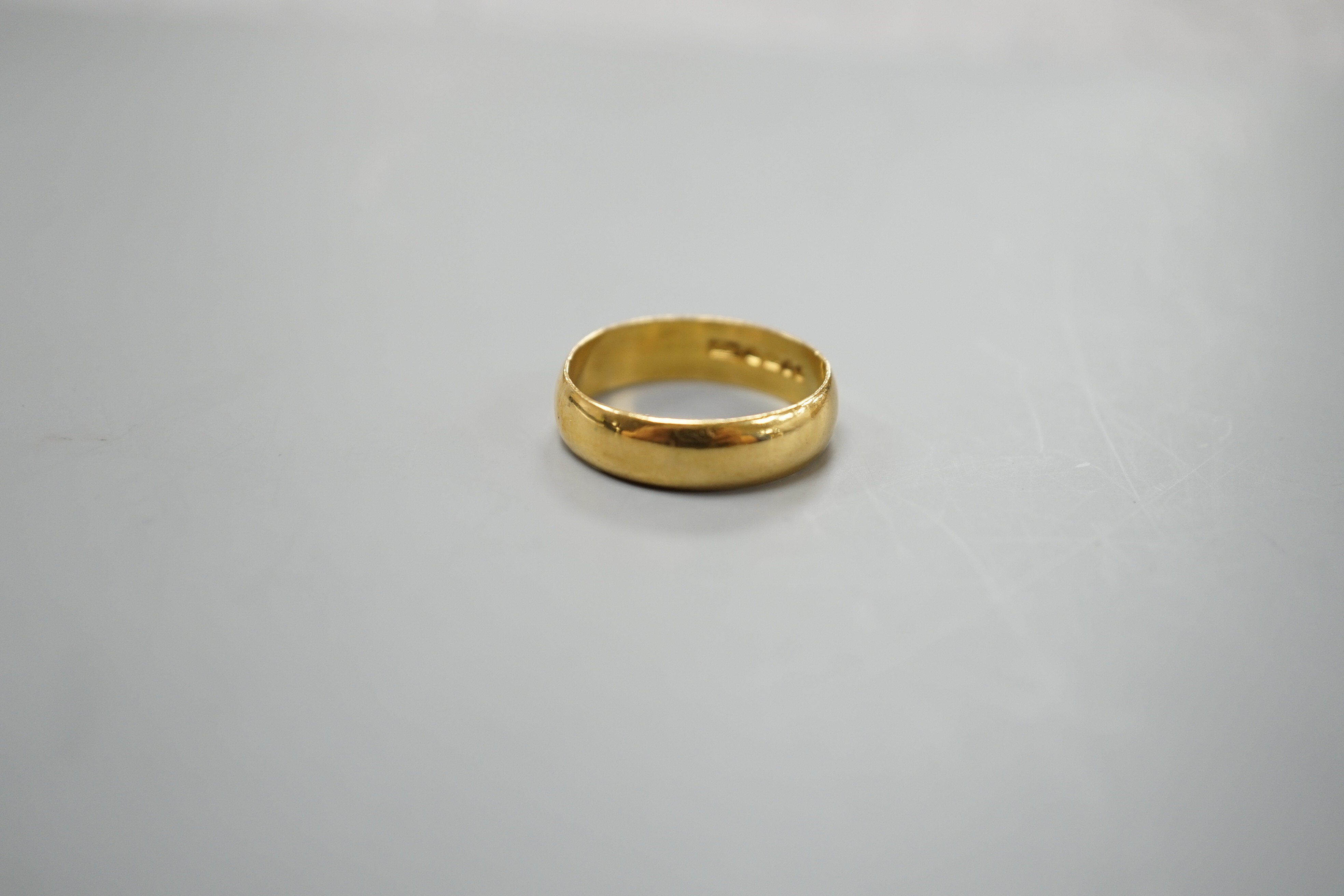 A 1960's 22ct gold wedding band, size R/S, 5.7 grams.